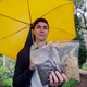 Katrina Spade, the founder and CEO of Recompose, displays a sample of the compost material left from the decomposition of a cow, left, and some of the combination of wood chips, alfalfa and straw used in the process.